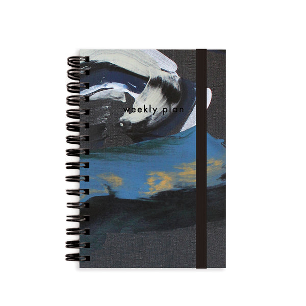 Moglea Dorian A6 weekly undated planner notebook with spiral binding and pages for organizing weekly schedules naturally.