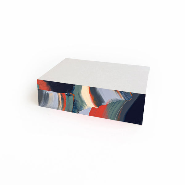 Small Nautilus Swirl Pad notepad by Moglea featuring a colorful, swirling design on the cover.
