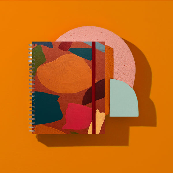 Moglea Rouge Medium A5 Notebook with soft red cover and lined pages, ideal for writing and journaling.