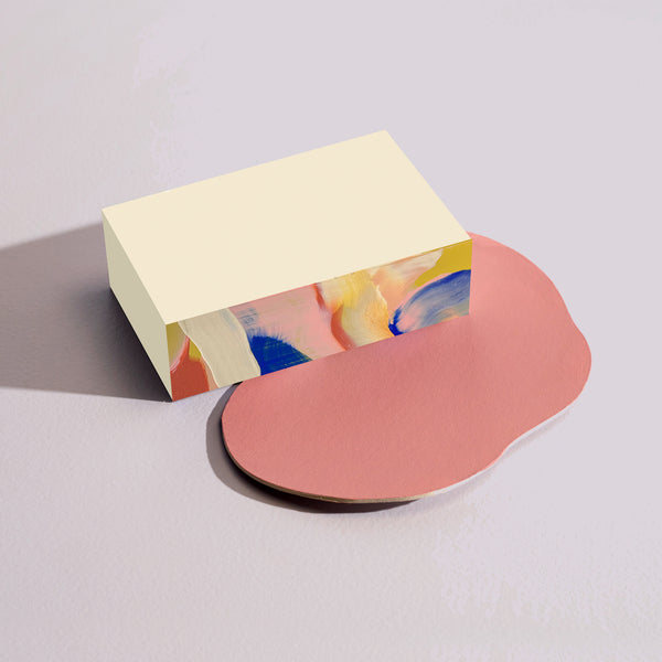 Small Moglea Citron Swirl notepad with a vibrant, hand-illustrated citrus swirl cover and unlined pages inside.
